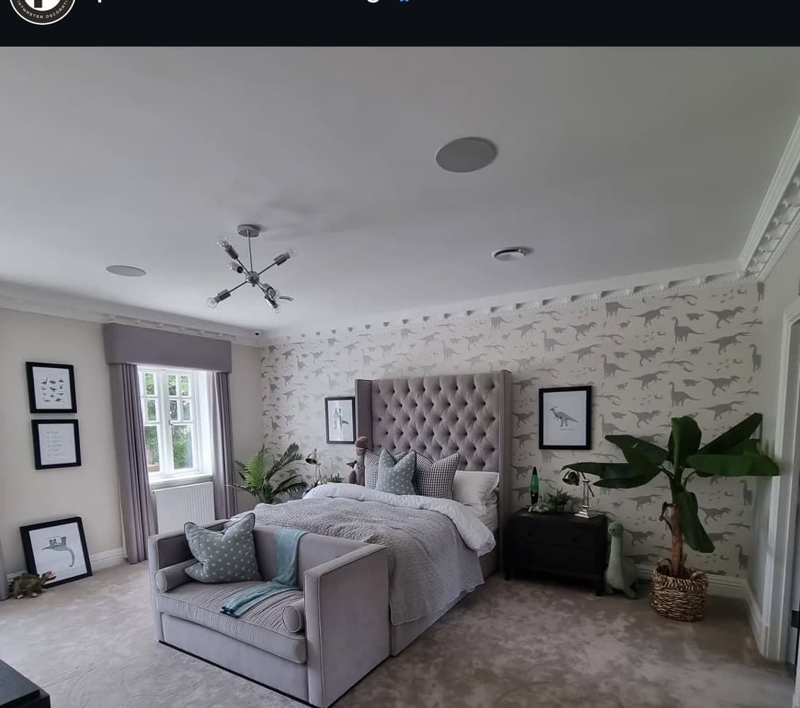 Landing with wall panelling below a dado rail and decorative cornice above